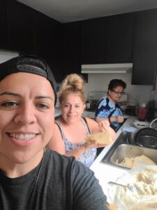 Chef Nancy Salazar cooking with her mother and grandmother, celebrating food and family.